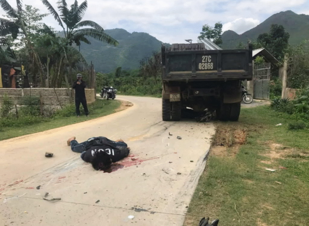 Aftermath of a crash between a truck and a motorbike: 1 dead 2