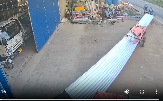 A motorbike is going too fast to see the long piece of metal