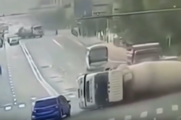 A cement truck overturns onto a car. 2 passengers killed