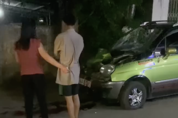 Car crashes into the back of a parked truck