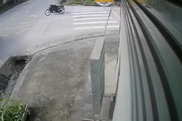 A motorcycle runs a red light