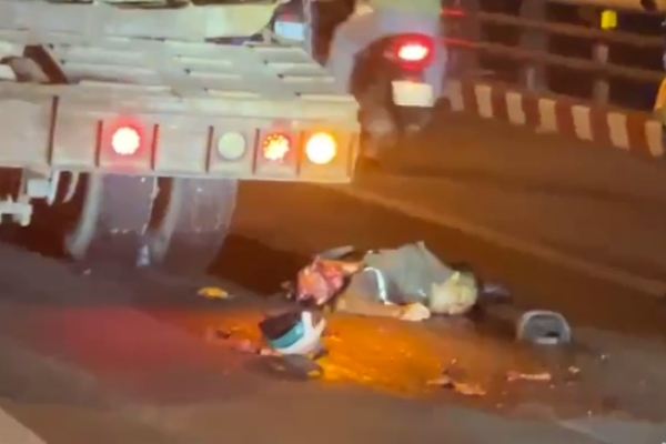 Aftermath of a traffic accident between a motorcycle and a truck
