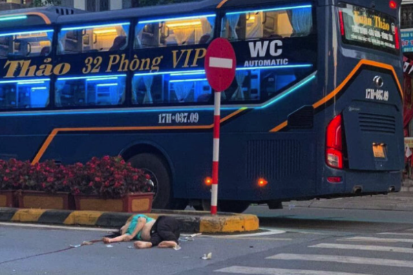A bus crashes into a motorbike at an intersection