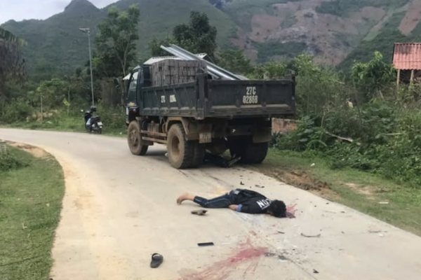 Aftermath of a crash between a truck and a motorbike: 1 dead