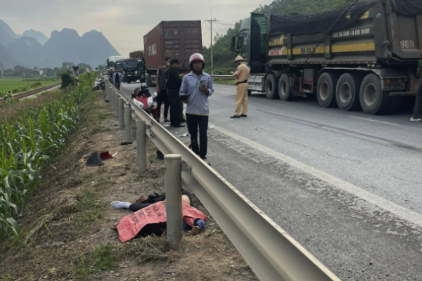 A motorbike loses control and is crushed by a heavy goods vehicle driving in the wrong lane.